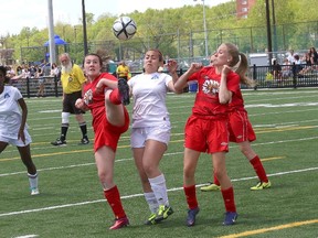 JOHN LAPPA/THE SUDBURY STAR 
Sara Falvo, middle, of Marymount Academy, and Chippewa Secondary School players Sarah Laplante, left, and Lauren Goodbridge battle for the ball during the girls NOSSA A soccer finals at James Jerome Sports Complex in Sudbury on Friday.