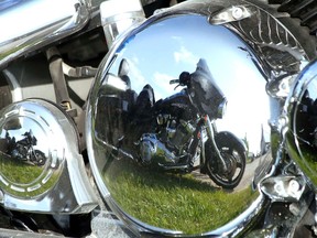 One motorcycle is reflected in the chrome of another at the Milverton Agri-Centre following the recent Forbidden Ride through Perth County. (MIKE BEITZ/The Beacon Herald)