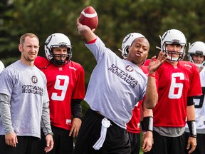 Ottawa RedBlacks veteran QB Henry Burris throws a pass during rookie camp at Carleton University on Friday May 30, 2014. Errol McGihon/Ottawa Sun/QMI Agency