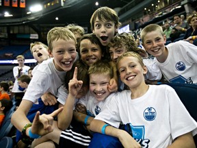 Members of the Sherwood Park Blades hockey team pose for a photo during the Ford  Drills and Skills event at Rexall Place in Edmonton, Alta., on Saturday, May 31, 2014. Codie McLachlan/Edmonton Sun/QMI Agency