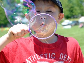 Tyler Perkins masters the bubble-blowing Saturday afternoon at the Bubble Station during the 3rd Annual Mount Elgin Family Fun Day at the Mount Elgin Community Centre and Ball Park. CHRIS ABBOTT/TILLSONBURG PHOTOS