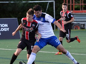 Ottawa Fury FC’s #17 Carl Haworth (L) and FC Edmonton’s #13 Frank Jonke (R) battle for the ball during their NASL soccer match at Carleton University in Ottawa on Saturday, May 31, 2014. (Matthew Usherwood/ Ottawa Sun)