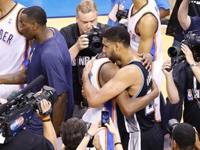 Oklahoma City Thunder forward Kevin Durant and San Antonio Spurs forward Tim Duncan embrace after Game 6 of the NBA Western Conference Finals at Chesapeake Energy Arena in Oklahoma City, May 31, 2014. (ALONZO ADAMS/USA Today)