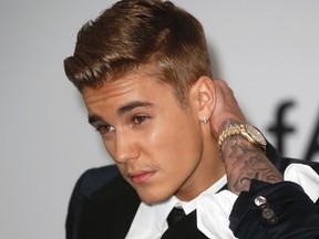 Canadian pop singer Justin Bieber arrives for amfAR's Cinema Against AIDS 2014 event in Antibes during the 67th Cannes Film Festival May 22, 2014. REUTERS/Benoit Tessier