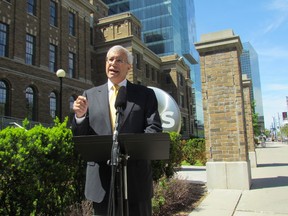 Nipissing PC candidate Vic Fedeli stands in front of MaRS buildings at University and College St. in Toronto on Sunday, May 1 2014. Fedeli accused the Kathleen Wynne government of a secret deal to bail out a soured real estate deal at a cost to taxpayers of hundreds of millions of dollars. (Antonella Artuso/Toronto Sun)