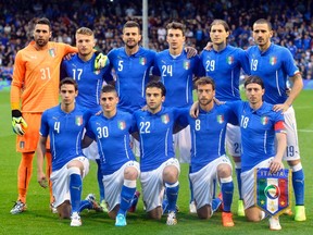 Italy's national soccer team players pose for a photo before their international friendly soccer match against Ireland at Craven Cottage in London May 31, 2014. (REUTERS)