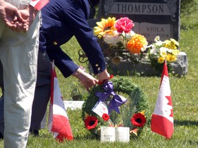 Wallaceburg Legion's Blanche Herman places a wreath on the gravesite of veteran Edward Beresford at Riverview Cemetary on Saturday, May 31, 2014. The Wallaceburg Veterans and Families Support Group fundraised to buy a headstone for Bereford's grave. The headstone was put in place a few weeks ago and a brief ceremony was held on Saturday afternoon.

DAVID GOUGH/COURIER PRESS/QMI AGENCY