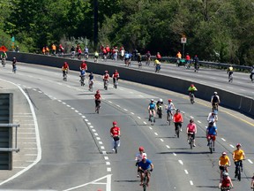 Some of the thousands of riders in the Becel Ride for Heart head up and down the Don Valley Parkway near Lawrence Ave. in Toronto on Sunday, June 1, 2014. (Michael Peake/Toronto Sun)