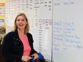 Teacher Julie MacRobbie gives her grade 3-4 class some homework at Temple Christian Academy on May 28. The school is closing this month after 23 years of providing Christian-based education.