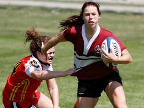OFSAA AA action between Bayside Secondary School Devils (red) and Holy Trinity Catholic High School at M.A. Sills Park in Belleville, Ont. Monday, June 2, 2014. The tournament also runs all day Tuesday June 3 and Wednesday, June 4. - Jerome Lessard/The Intelligencer/QMI Agency