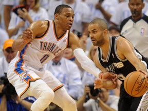 San Antonio Spurs guard Tony Parker (9) handles the ball against Oklahoma City Thunder guard Russell Westbrook (0) during the second quarter in game six of the Western Conference Finals of the 2014 NBA Playoffs at Chesapeake Energy Arena. (Mark D. Smith-USA TODAY Sports)