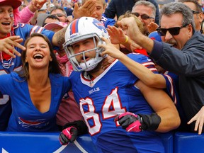 Buffalo Bills tight end Scott Chandler (84) celebrates a touchdown during the second half with fans against the Cincinnati Bengals at Ralph Wilson Stadium last season. (Timothy T. Ludwig-USA TODAY Sports)