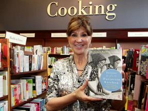 Mary-Ann Kirkby poses for a photo with her book Secrets of a Hutterite Kitchen, at the Chapters South Point, 3227 Calgary Trail, in Edmonton Alta., on Monday May 26, 2014. David Bloom/Edmonton Sun/QMI Agency
