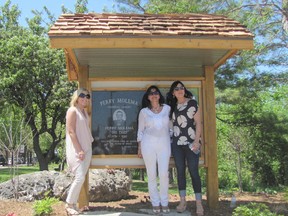 Sherry Molema, centre, and her daughters Lindsay, left and Melissa, pose after unveiling the sign for the Perry Molema Memorial Park.