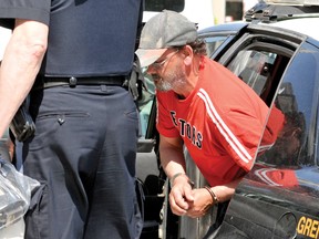 Mark Gagne, arrested after the hit-and-run death of a cyclist near Kemptville, is led into the Brockville Jail after being remanded into custody until Thursday (ALANAH DUFFY/The Recorder and Times).