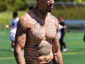 Tattooed receiver D.J. Woods was working in a kitchen when he got the call from the RedBlacks. ERROL McGIHON