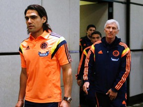 Colombian star Radamel Falcao (left) and coach Jose Pekerman arrive for the announcement of the 23-man squad for the World Cup in Buenos Aires, June 2, 2014. (ENRIQUE MARCARIAN/Reuters)
