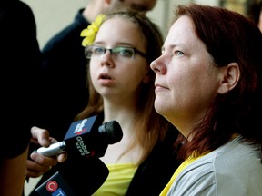 Renaye Wade and her mother Tammy Wade talk to the media outside the Edmonton Law Courts, in Edmonton Alta., on Monday June 2, 2014. Renaye's was seriously injured after being involved in a March 15, 2014 vehicle collision. The driver who hit her was sentenced Monday. David Bloom/Edmonton Sun