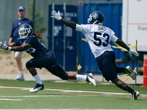 Running back Curtis Steele stretches for a pass at Argonauts training camp on Monday. (Michael Peake/Toronto Sun)