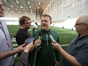 Chris Jones, shown here being scrummed at Eskimos camp on the weekend, got his first job as an assistant with Phillip Lolley in the 1980s. (Ian Kucerak, Edmonton Sun)