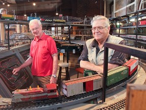 Long-time volunteers Robert Mills and Hugh Maclean in the model train collection at the Pump House Steam Museum. Julia McKay/The Whig-Standard