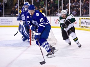 Marlies defenceman Stuart Percy is pursued by Texas Stars centre Chris Mueller as goaltender Drew MacIntyre watches during Game 6 of the AHL Western Conference final last night. (Christina Shapiro/Texas Stars)