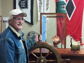 George Klompstra displays a replica of the wheel of the HMC Q105 that he made at the Sombra Museum. Klompstra made the wheel based on old photos of the ship's helm. The wheel is currently on display at the museum.