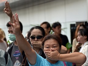 Opponents of Thailand's military coup are risking arrest by flashing the three-finger salute from the "Hunger Games" movies to defy a junta that has banned all public protests. The gesture has become the unofficial symbol of resistance against a military regime that has suspended democracy and severely curtailed freedom of expression.    

AFP PHOTO / FILES / Christophe ARCHAMBAULT