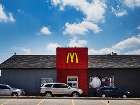 Cars line up in a drive through lane at a McDonalds fast food restaurant.

REUTERS/Mark Blinch