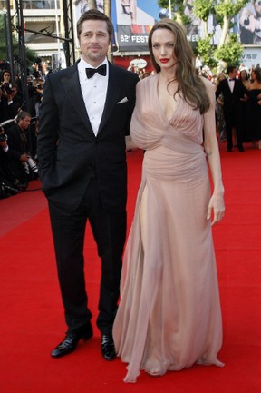 Angelina Jolie (wearing a vintage Hermes dress), Brad Pitt