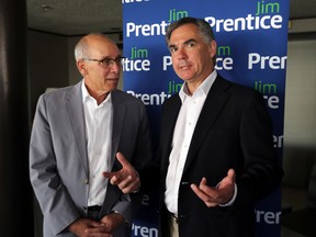 Then-PC leadership candidate Jim Prentice (r) speaks to the media alongside Stephen Mandel, who would go on to be named Premier Prentice's health minister. Mandel is unelected and faces a byelection in Edmonton Whitemud. (Perry Mah/Edmonton Sun file)