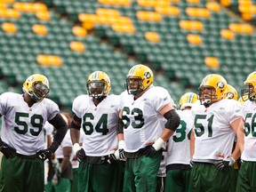 CFLPA treasurer Brian Ramsay, No. 63, says even though their not in the same city, the association and the league are still talking. (Edmonton Sun file)