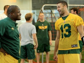 Eskimos head coach isn't concerned about evaluating 2013 all-star Almondo Sewell, left, whose return to camp this season has been delayed by injury. (David Bloom, Edmonton Sun)