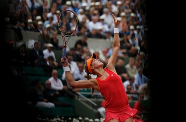Eugenie Bouchard of Canada serves to Carla Suarez Navarro of Spain during their women's quarter-final match at the French Open on June 3.