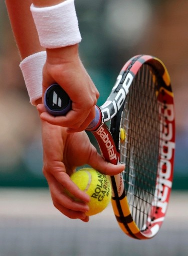Eugenie Bouchard of Canada prepares to serve to Carla Suarez Navarro of Spain during their women's quarter-final match at the French Open on June 3.