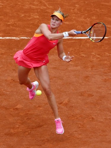 Eugenie Bouchard of Canada returns the ball to Carla Suarez Navarro of Spain during their women's quarter-final match at the French Open on June 3.