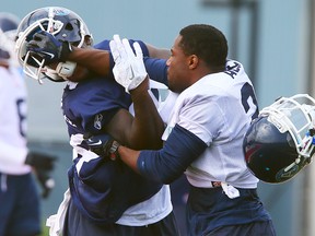 Tempers flare between Jarred Fayson and Vincent Agnew during Argos training camp at York University on June 3. (Dave Abel, QMI Agency)