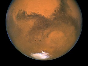 NASA's Hubble Space Telescope snapped this portrait of Mars within minutes of the planet's closest approach to Earth in nearly 60,000 years in this picture taken by NASA on August 27, 2003. (REUTERS/NASA/Handout via Reuters)