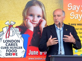 Glen Pearson, co-director of the London Food Bank, helps to launch the 18th annual London Cares Curb Hunger Food Drive at the FreshCo Grocery Store in London on Wednesday. MORRIS LAMONT / THE LONDON FREE PRESS / QMI AGENCY