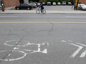 An Ottawa cycling group says painted sharrows do nothing to promote safe cycling. Tony Caldwell/Ottawa Sun