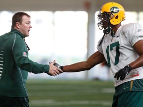 Eskimos head coach Chris Jones, seen here with receiver Shamawd Chambers, says if there's a Canadian who can help the team win games, he's all for it. (Ian Kucerak, Edmonton Sun)