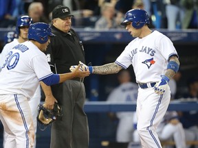 Catcher Dioner Navarro (left) and third baseman Brett Lawrie are the only players on the Blue Jays not from the United States or the Dominican Republic. (Tom Szczerbowski/Getty Images/AFP)