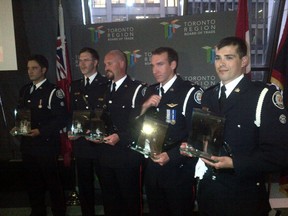 Six Toronto Police officers were named Officers of the Year on June 4, 2014 for rescuing teens trapped in a car that had plunged into the Don River in March 2013. (Terry Davidson/Toronto Sun)