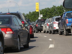 Bomber fans will have to pay to take the bus to games this season. The team's gameday transportation plan has taken on added significance since last season's disastrous efforts, which saw traffic so congested that many fans missed the start of the game. (FILE PHOTO)