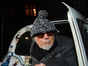 File photograph shows former British pop star Gary Glitter returning to his home in London October 28, 2012. REUTERS/Paul Hackett/Files