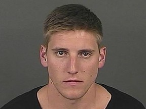 Jack Elway is seen in a mugshot following accusations that he assaulted his girlfriend.