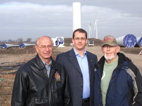 Lambton-Kent Middlesex MP Bev Shipley, left, along with Lambton-Kent-Middlesex MPP Monte McNaughton, centre, and former Liberal MP Rex Crawford, of the Dover area, are calling for an immediate moratorium on industrial wind turbine construction in Ontario. The trio held a press conference Thursday, Nov. 16, 2012, in front of a wind farm site near Crawford's Bear Line home. (Daily News file photo)