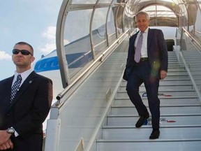 U.S. Defense Secretary Chuck Hagel walks down the stairs during his arrival on a U.S. military aircraft at Paris-Le Bourget Airport in Paris, June 5, 2014. REUTERS/Pablo Martinez Monsivais/Pool