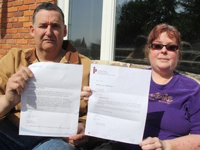 Dennis and Tricia Pede hold responses from the Information and Privacy Commissioner of Ontario and Centric Health Surgical Centre - Sarnia, after the Sarnia couple inquired about a potential breach of patient information. They want to spread awareness that patient information may not be as private as people think. (TYLER KULA, The Observer)