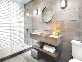 Subway tile, concrete sink and concrete-look flooring gives the renovated basement bathroom an industrial look.